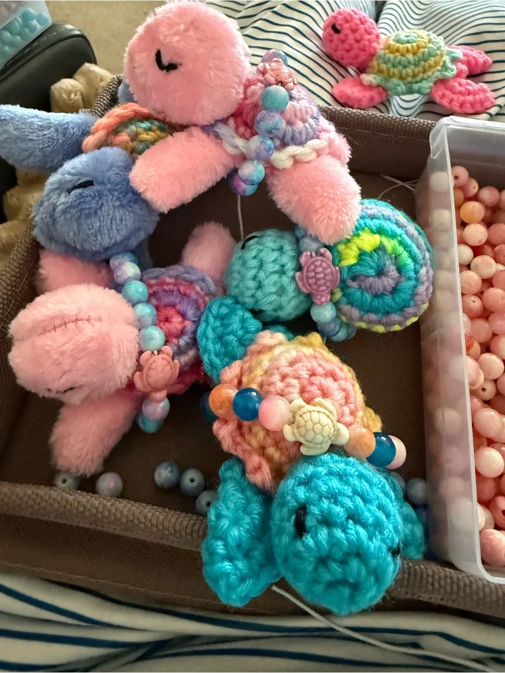 Pink plush toy turtle with crocheted with small turtle gemstone bracelet!